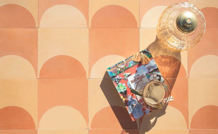 Warm coffee and a book in the soft morning sunshine on a terracotta cement tile by Glazentile