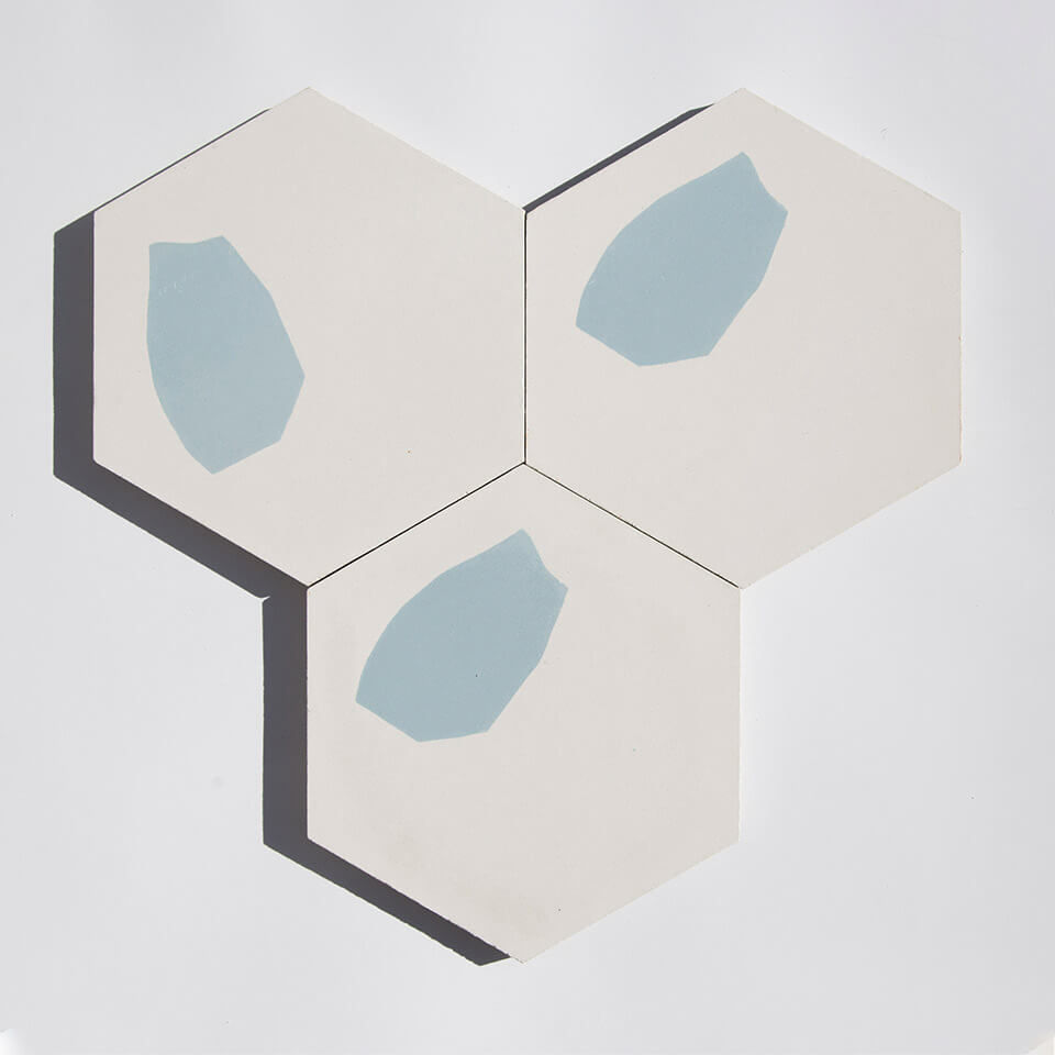 Blue and white hexagonal terrazzo style cement tile designed by Glazentile