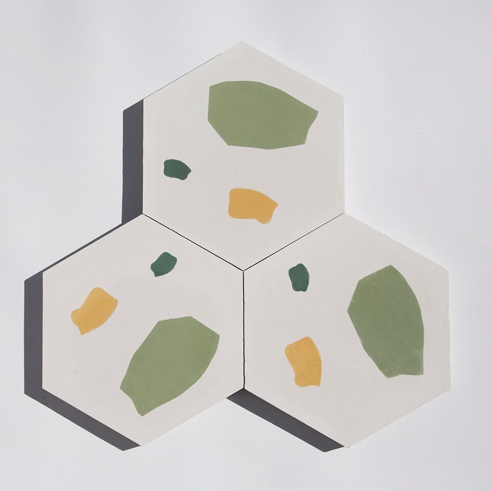 Green and yellow hexagonal terrazzo style cement tile designed by Glazentile