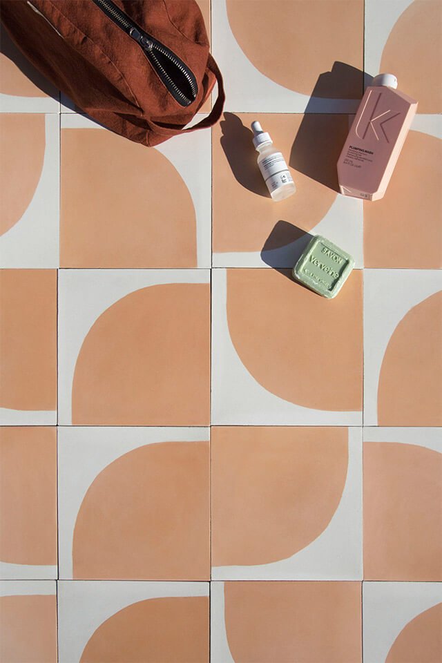 Morning ritual beauty products on a nude color cement tile designed by Glazentile