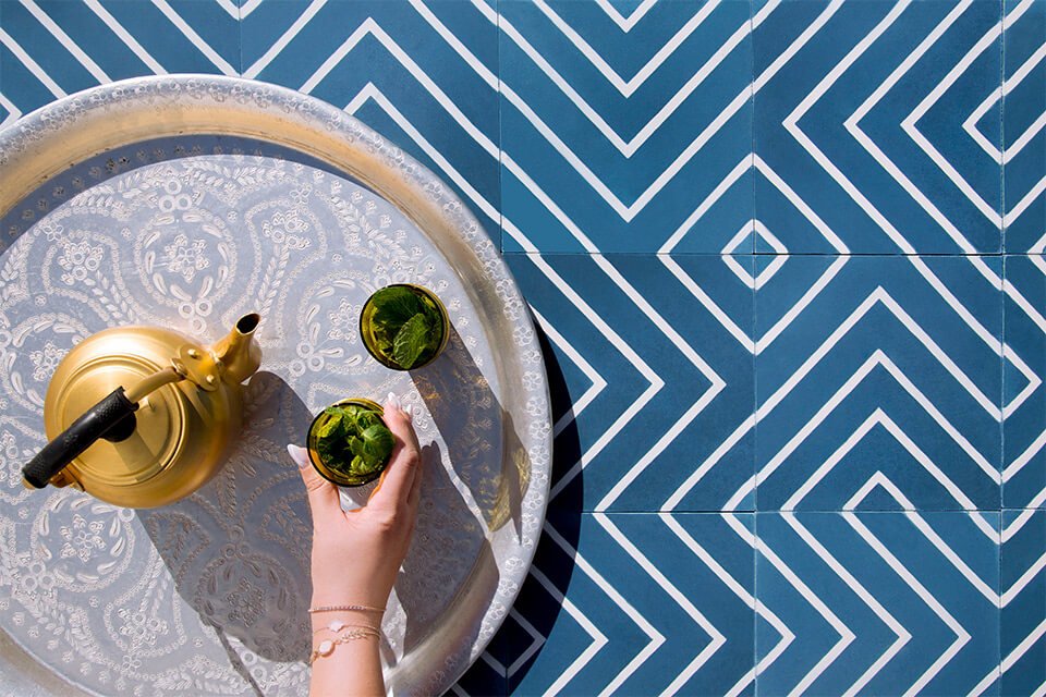Authentic Moroccan mint tea on a blue maze pattern cement tile from Glazentile