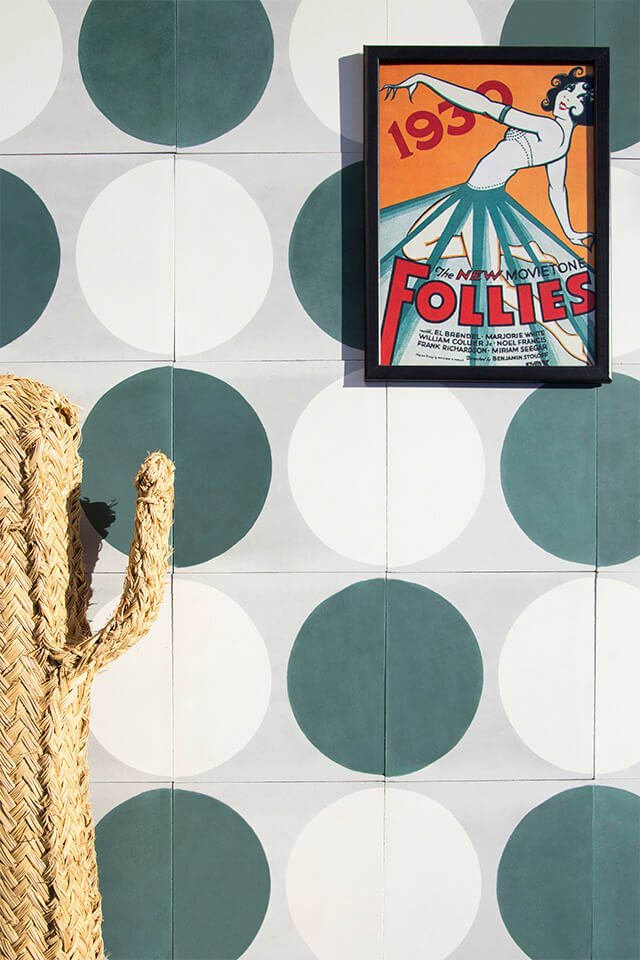 Green and white circle pattern cement tile by Glazentile and a straw cactus